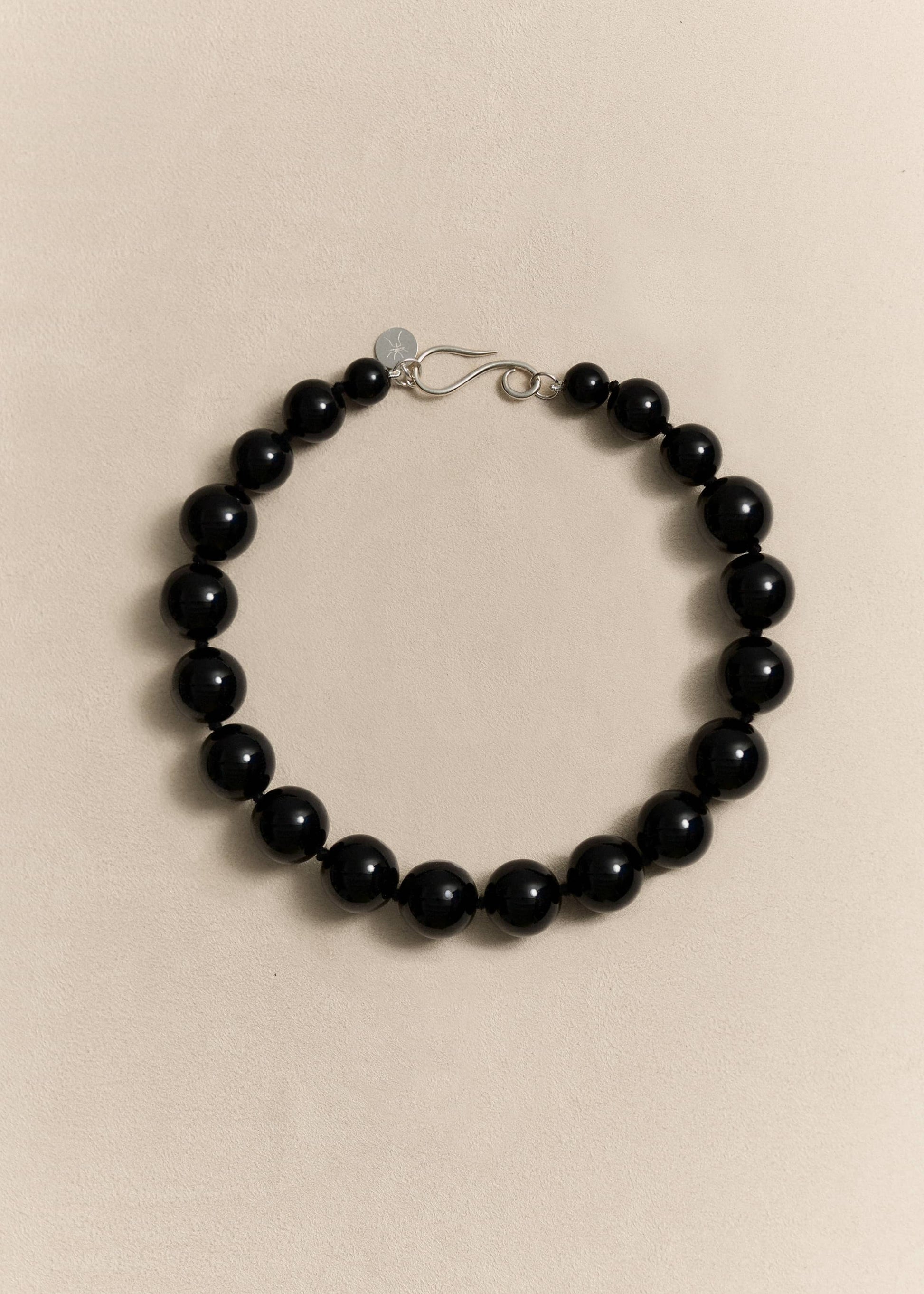 A bold handcrafted necklace featuring oversized natural onyx beads and sterling silver. Made slowly in small batches.