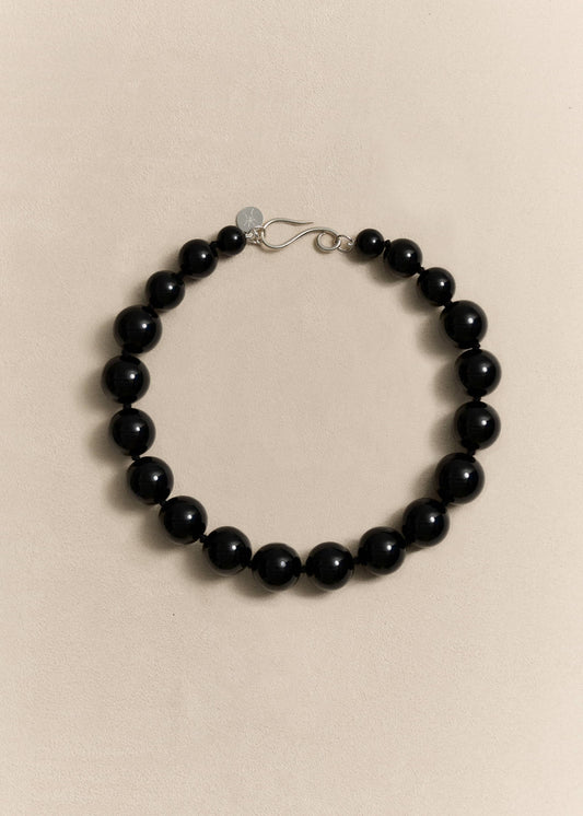 A bold handcrafted necklace featuring oversized natural onyx beads and sterling silver. Made slowly in small batches.
