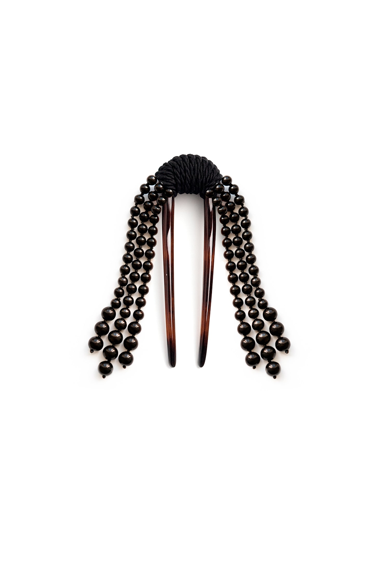 Discover the Cande Comb Black — an artisanal hair comb made from recycled acetate with handmade tassels and silk details. Elegant, handcrafted accessory for timeless style.