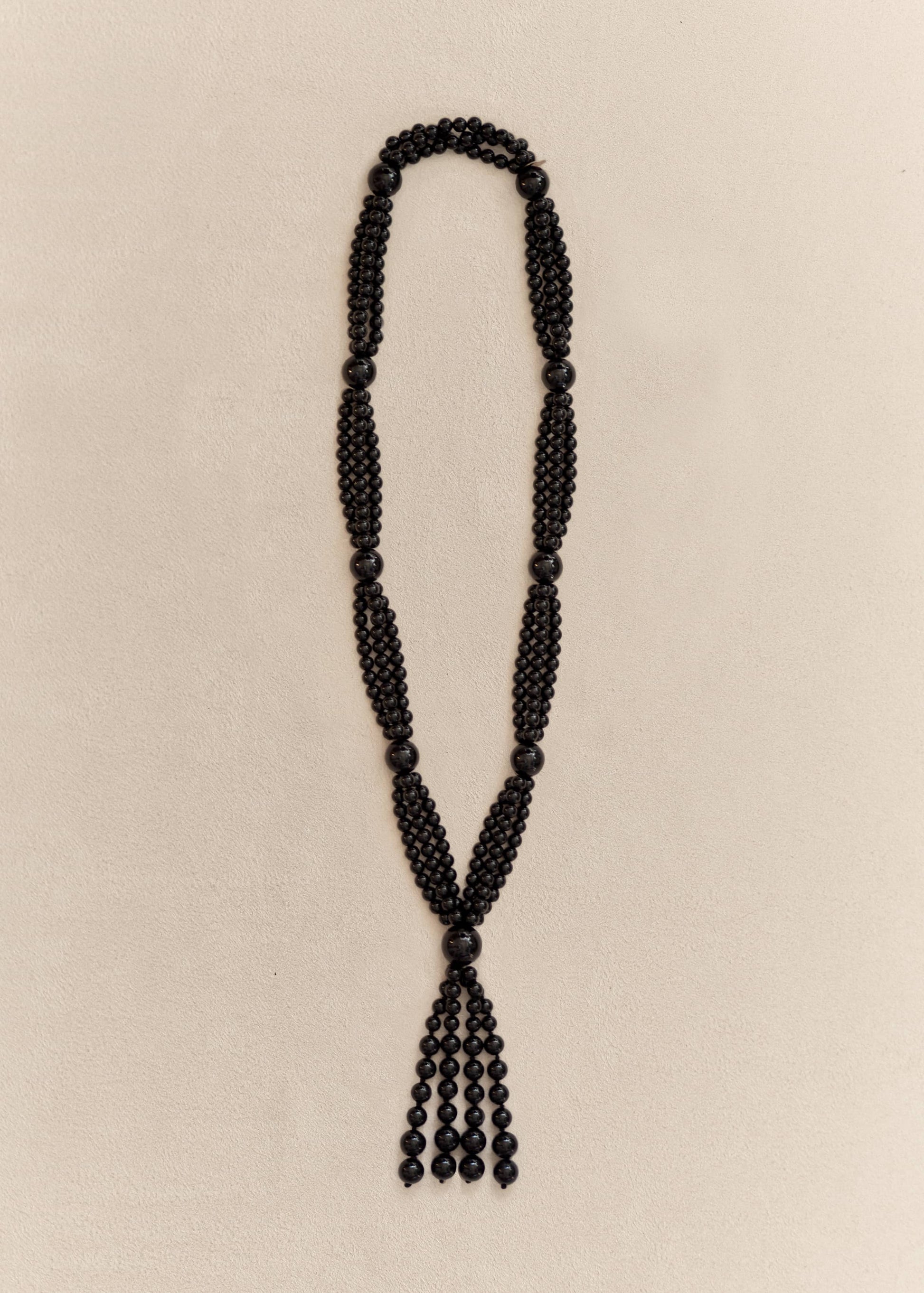 Handcrafted with polished onyx beads and sterling silver details, the Farol Necklace is a modern heirloom made to be worn for years.