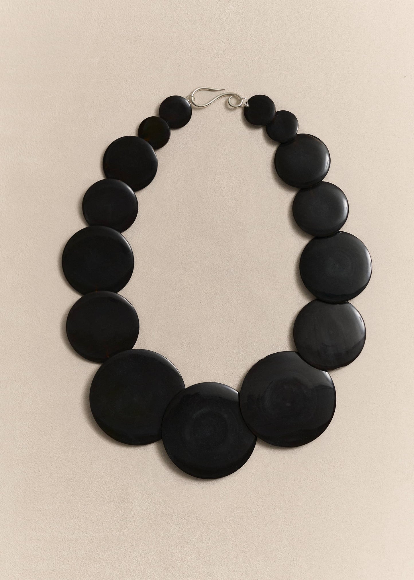 A handcrafted necklace celebrating the beauty of natural shell and sterling silver through sculptural, timeless design.