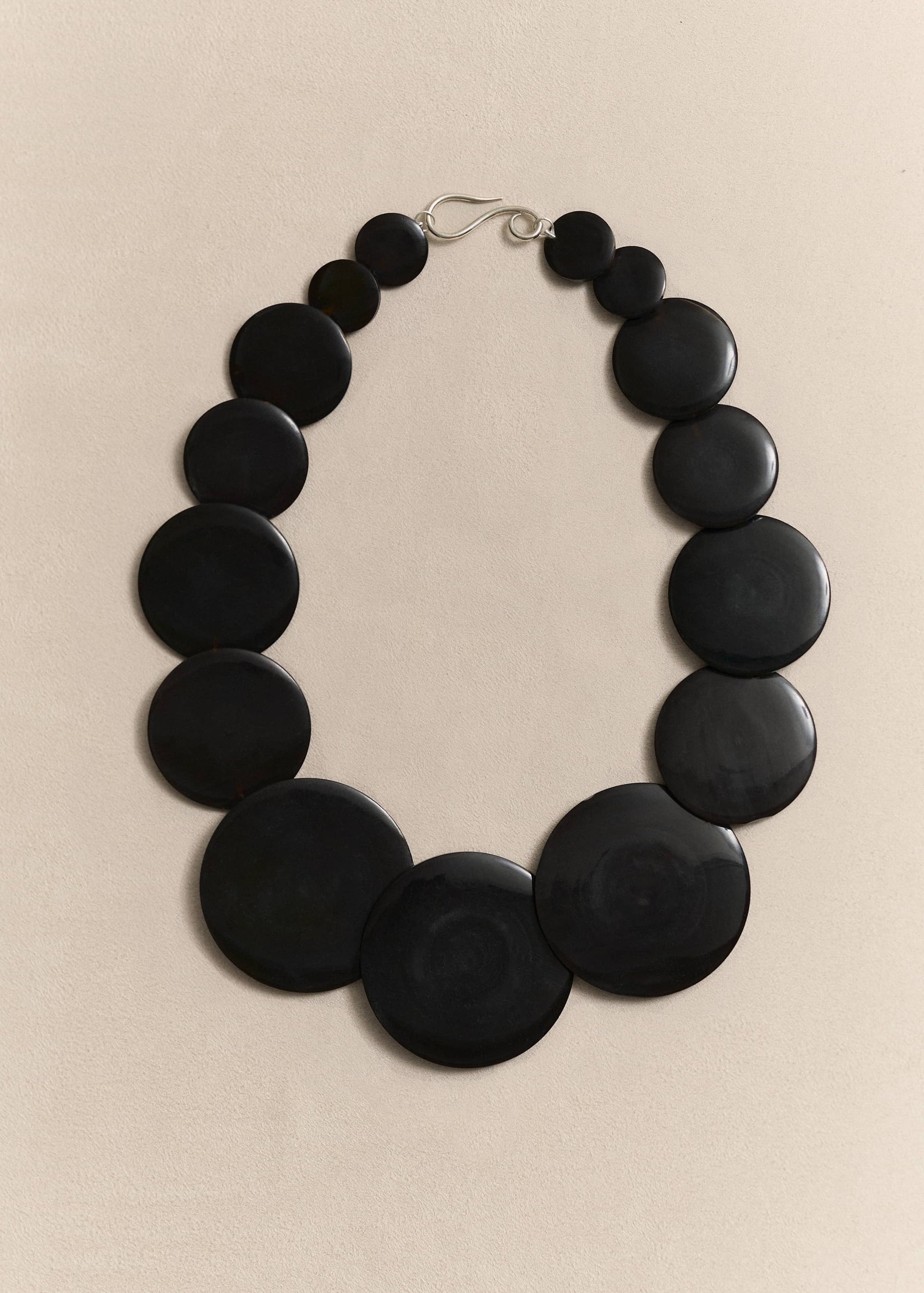 A handcrafted necklace celebrating the beauty of natural shell and sterling silver through sculptural, timeless design.