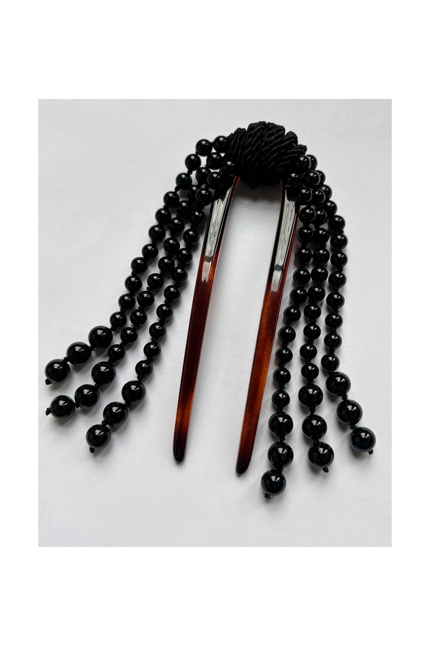 Mosquito Cande Comb Onyx handcrafted hair accessory with onyx tassels