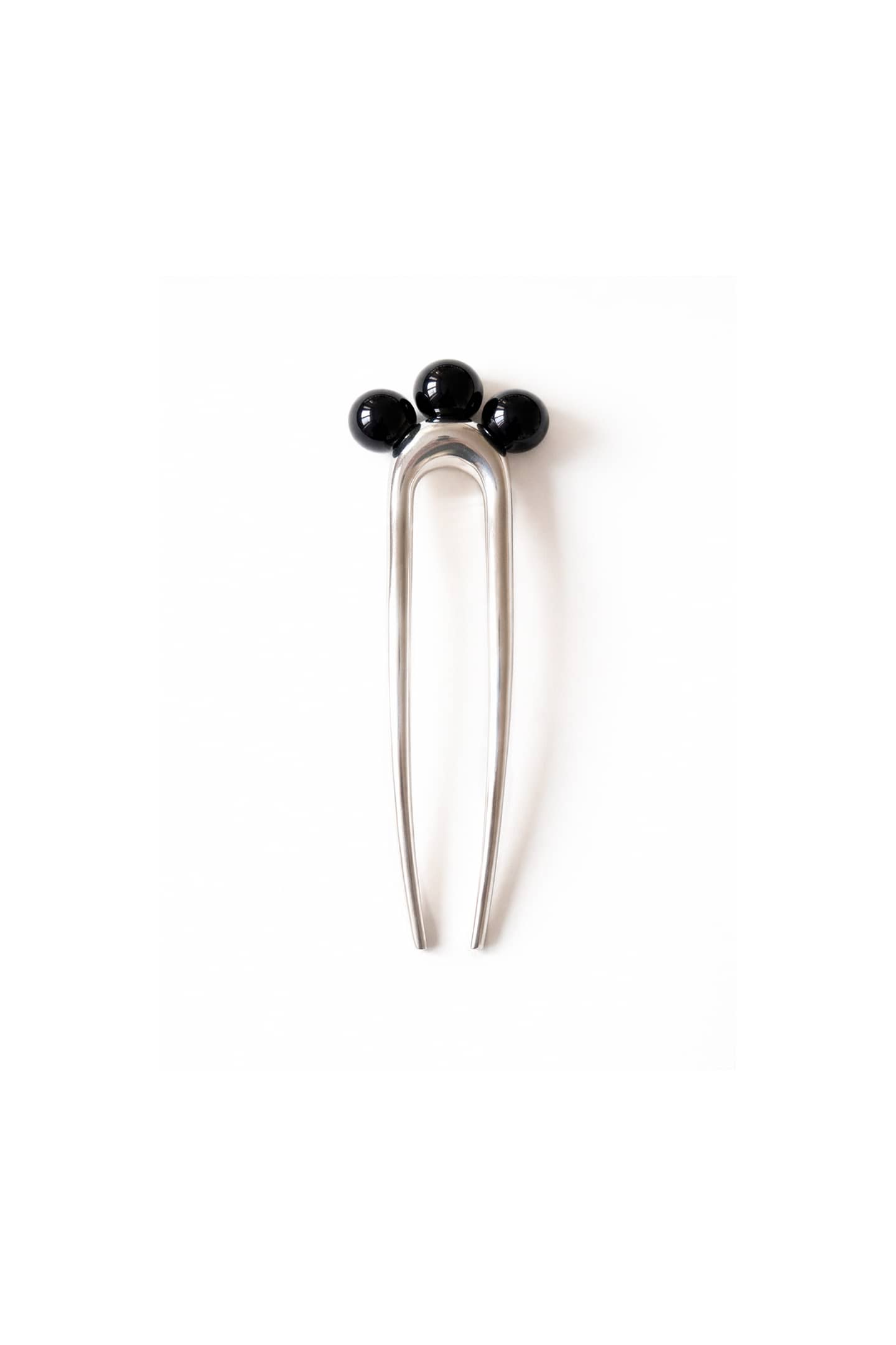 Nusa hair comb handcrafted in silver-plated brass with three polished onyx spheres, modernist sculptural hair accessory made in Barcelona.