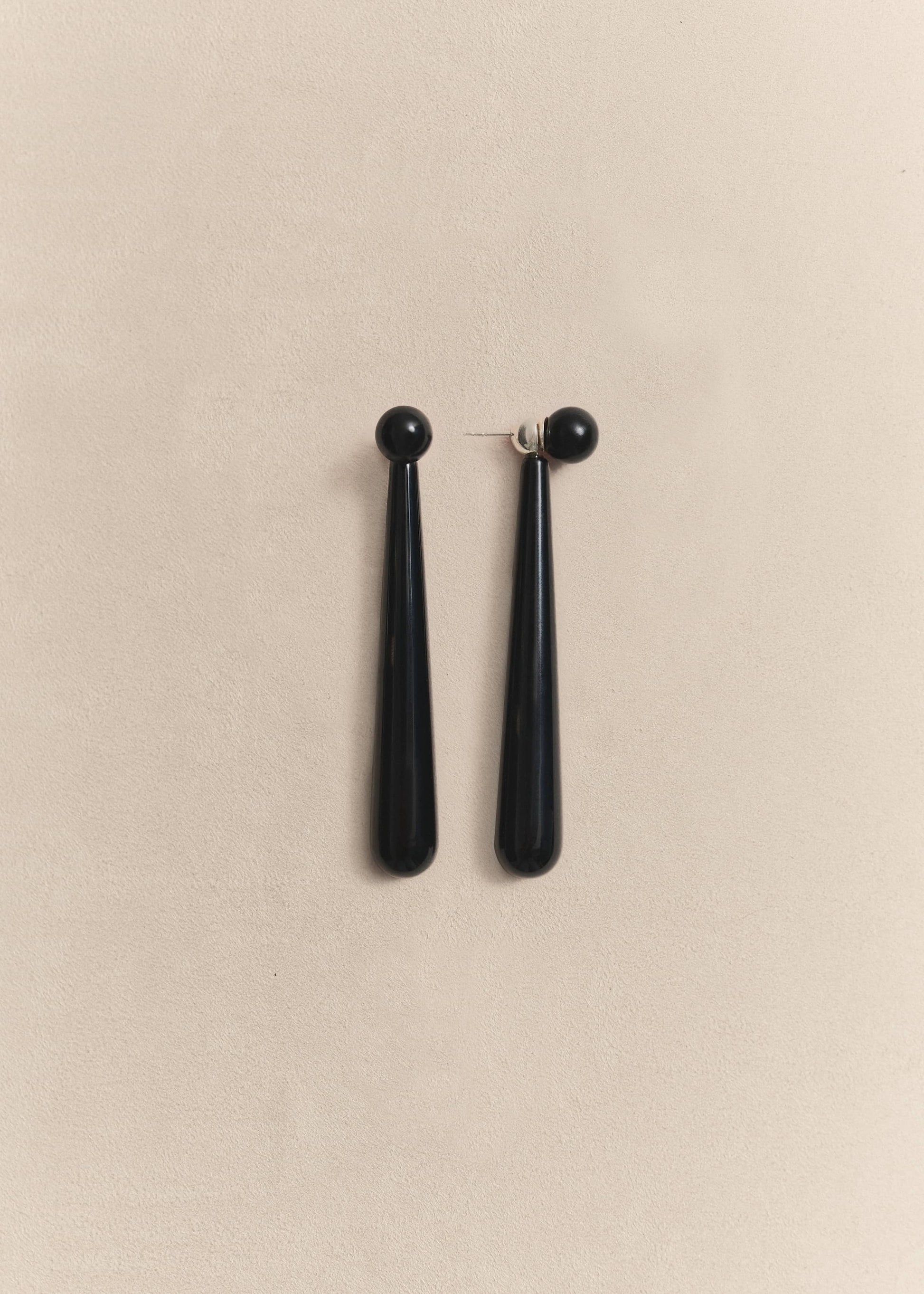 Statement sterling silver earrings handcrafted with natural onyx beads. Modernist forms with enduring elegance.