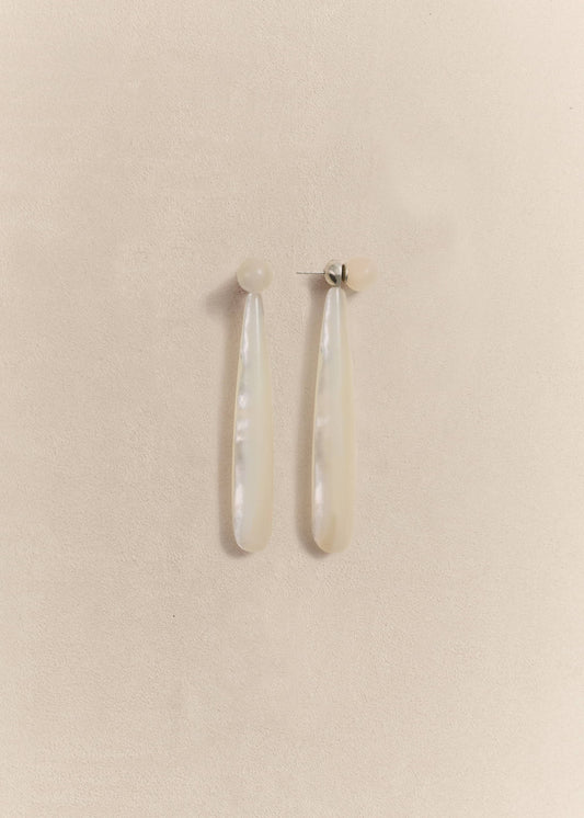Sculptural sterling silver earrings with luminous mother of pearl. Handmade in small batches using traditional techniques.
