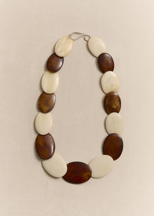 Handcrafted from responsibly sourced natural bone and sterling silver. A timeless necklace balancing sculptural form with everyday wearability.