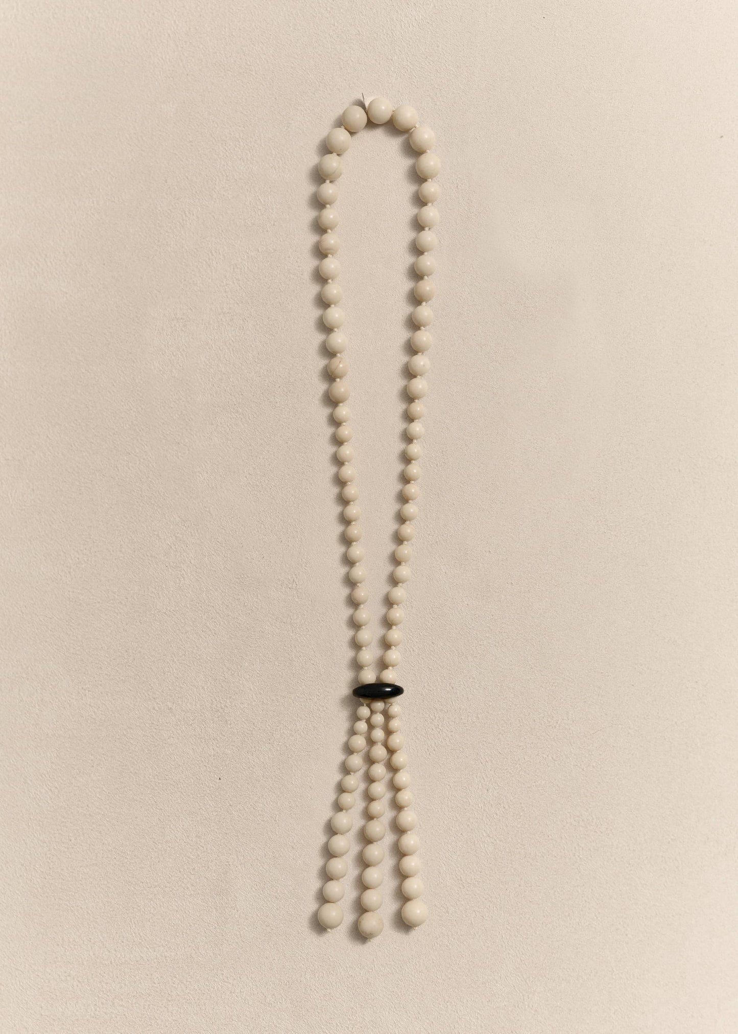 Handcrafted with jade, onyx, silk thread and sterling silver. Every bead is individually knotted by hand.