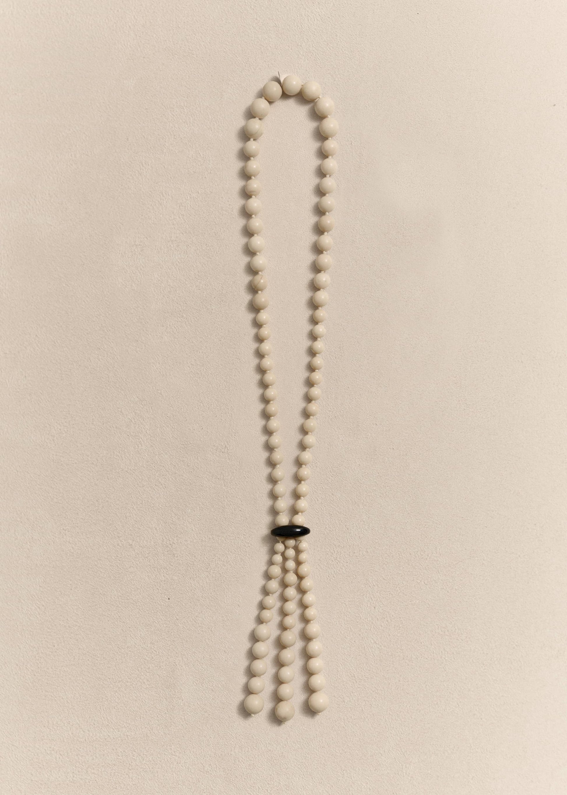 Handcrafted with jade, onyx, silk thread and sterling silver. Every bead is individually knotted by hand.