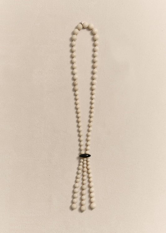 Handcrafted with jade, onyx, silk thread and sterling silver. Every bead is individually knotted by hand.
