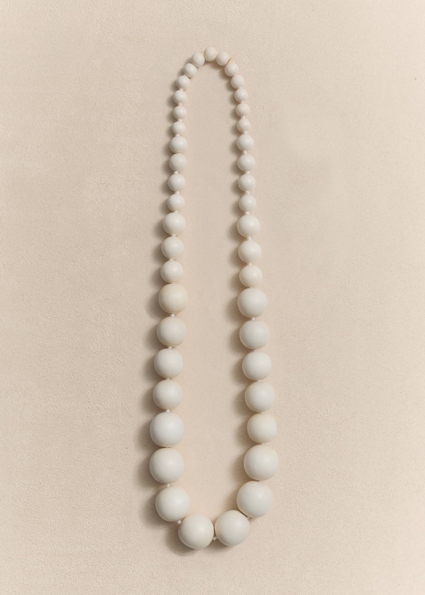 A handcrafted necklace made from natural yakal wood and sterling silver. Sculptural proportions shaped through slow craftsmanship.