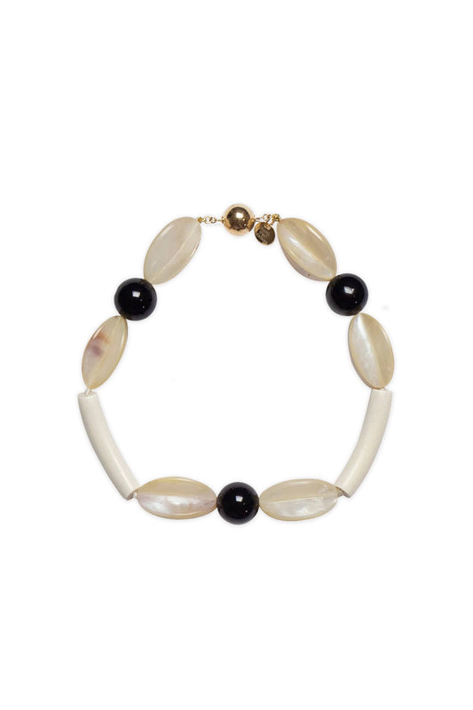 Rosario necklace by Mosquito, combining onyx and wood with handmade detail in limited edition