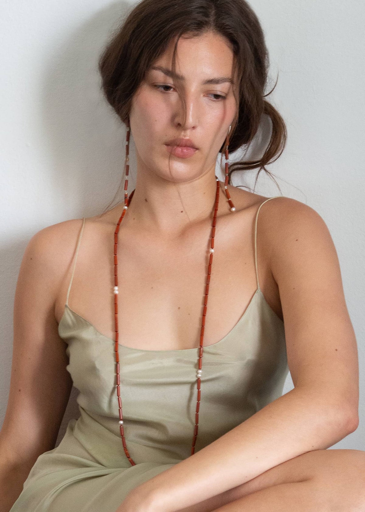 Handmade statement earrings with freshwater pearls and jasper, meticulously crafted and assembled in Mosquito’s atelier.