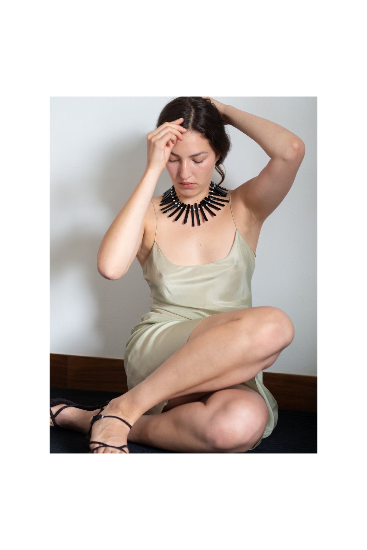 Handmade statement necklace with pearl, black onyx and sculptural beads, created in small batches by Mosquito.