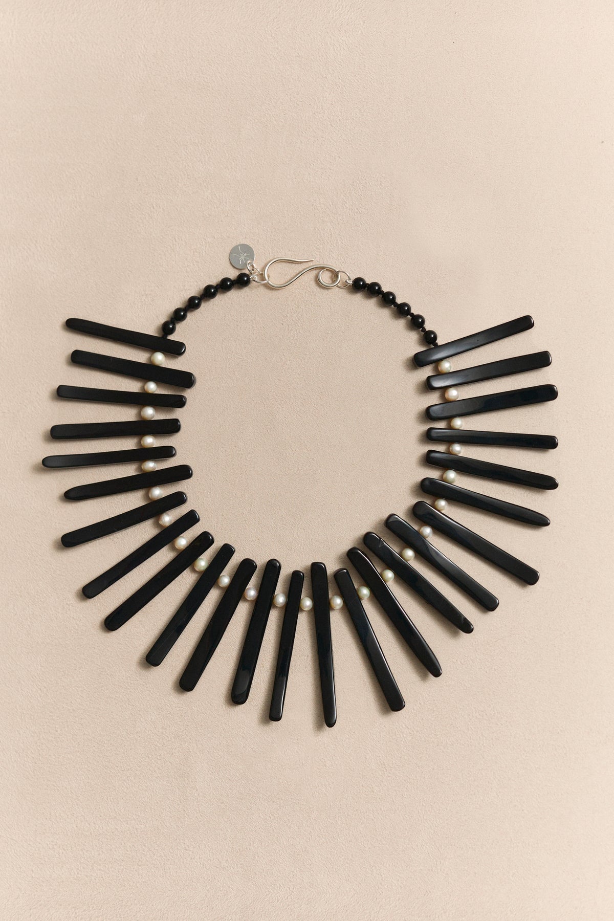 TAVIRO modernist necklace with pearl and black onyx, a sculptural collector piece designed to be worn beyond seasons.