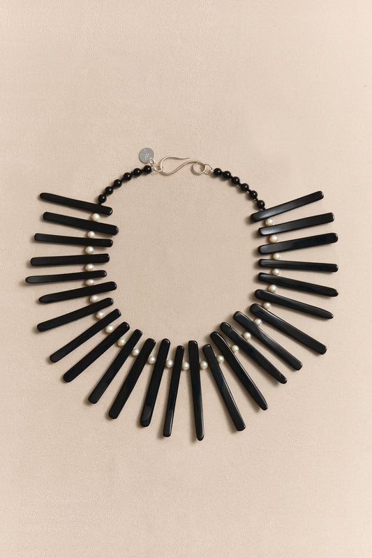 TAVIRO modernist necklace with pearl and black onyx, a sculptural collector piece designed to be worn beyond seasons.